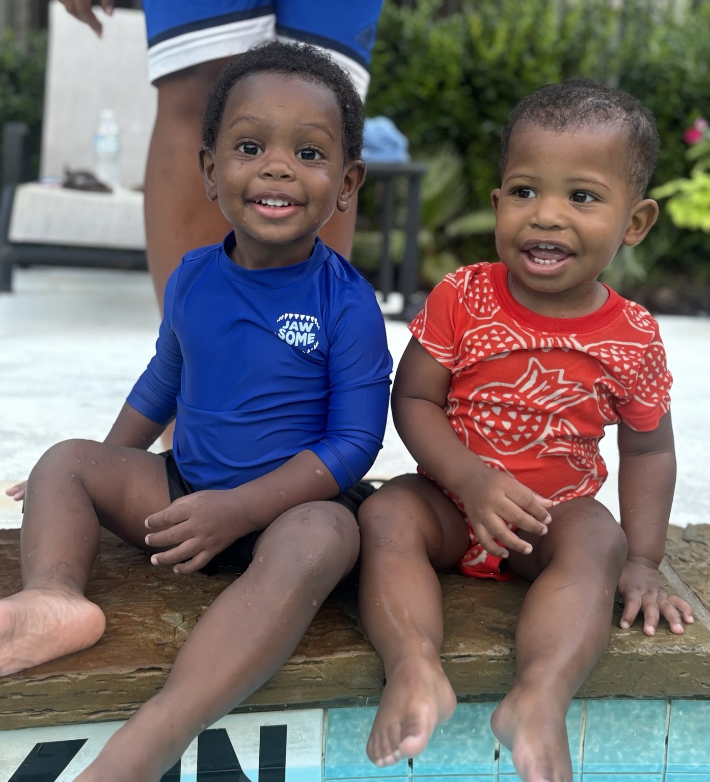 Two children smiling together outdoors