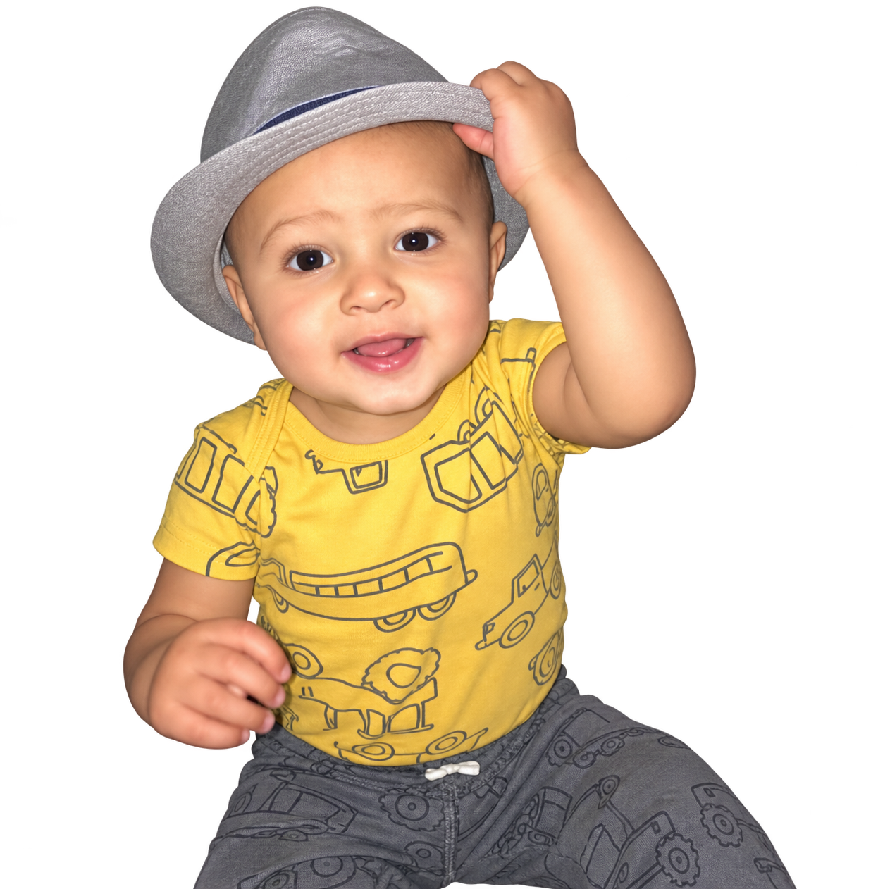 Smiling toddler wearing a gray hat and yellow shirt